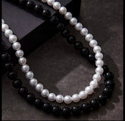 Doppia collana in perle bianca e nera