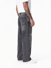 TANGERI jeans baggy fit con abrasioni cenere