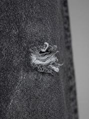 TANGERI jeans baggy fit con abrasioni cenere